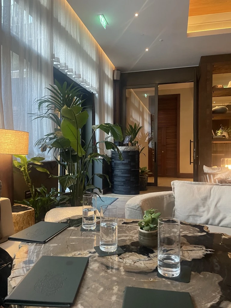 The lounge at 1 Hotel Mayfair set for an evening