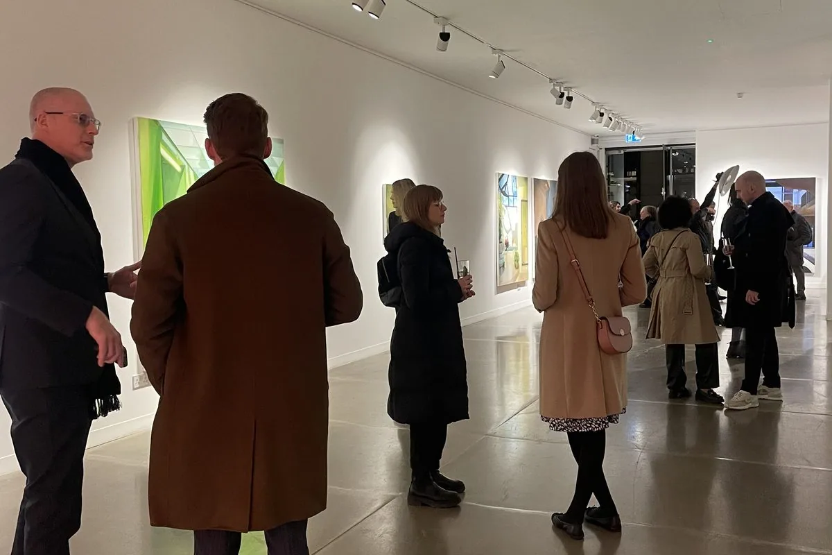 Guests at a private view in a Mayfair gallery
